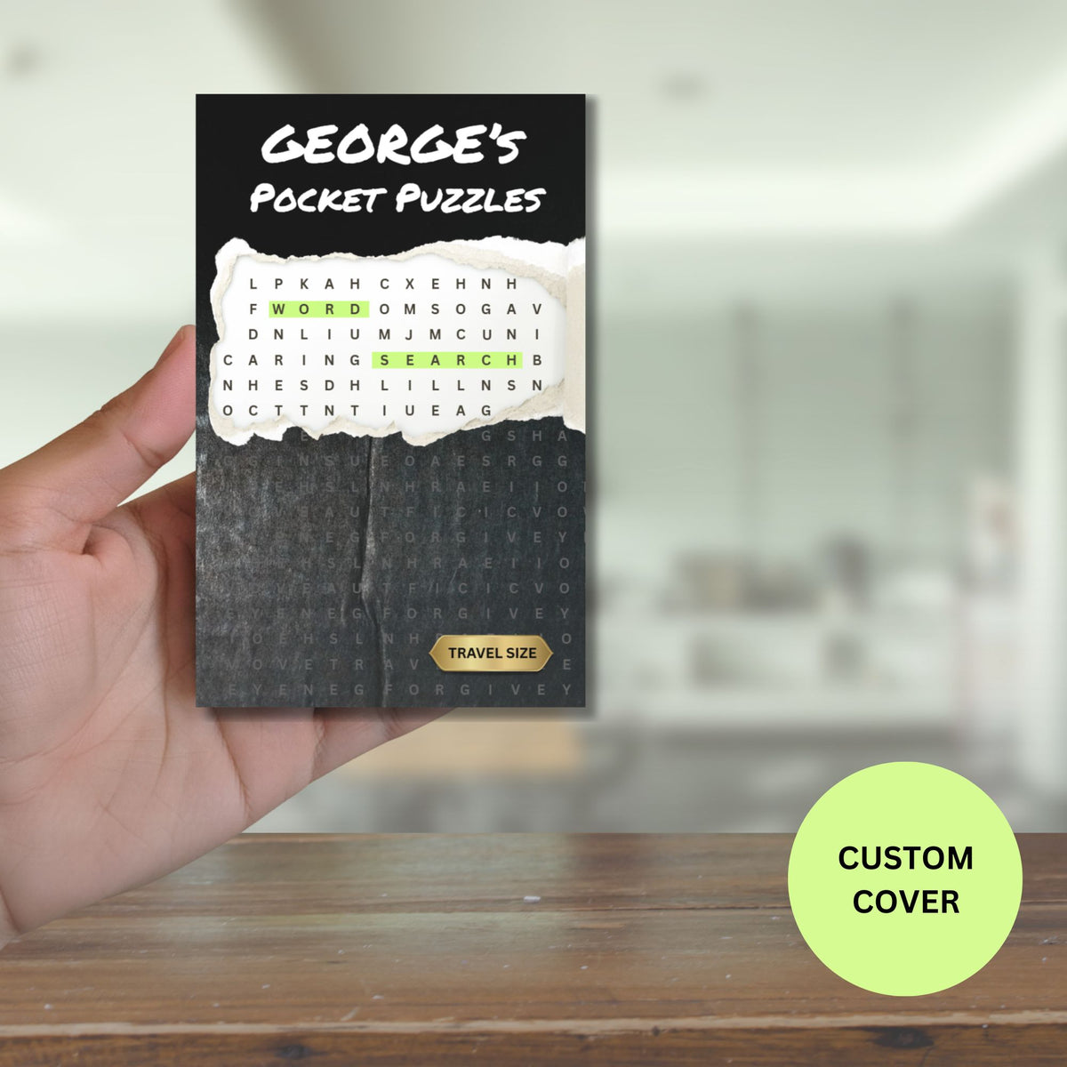 Hand holding a word serach pocket puzzles book with a custom name on the cover. 