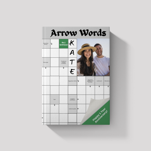 Front cover of an 'Arrow Words' book with a custom photo of a couple. The design features a personalized name and puzzle clue integrated into the grid, with a printed gift message in the top corner.