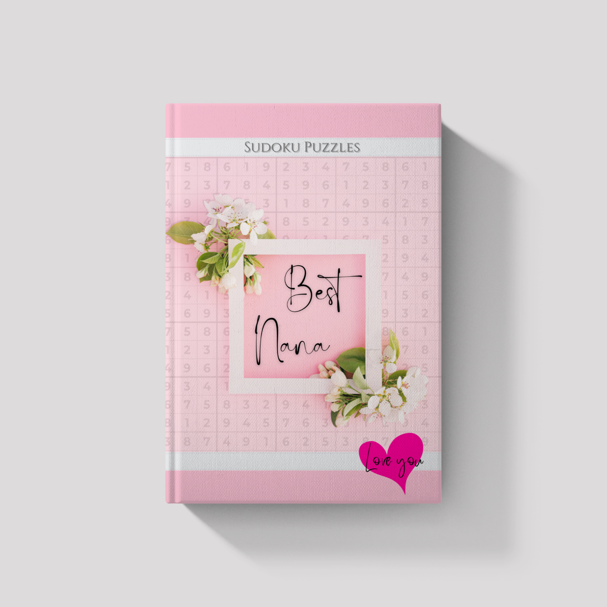 Pink Sudoku puzzle book titled 'Best Nana' with floral design on a white background