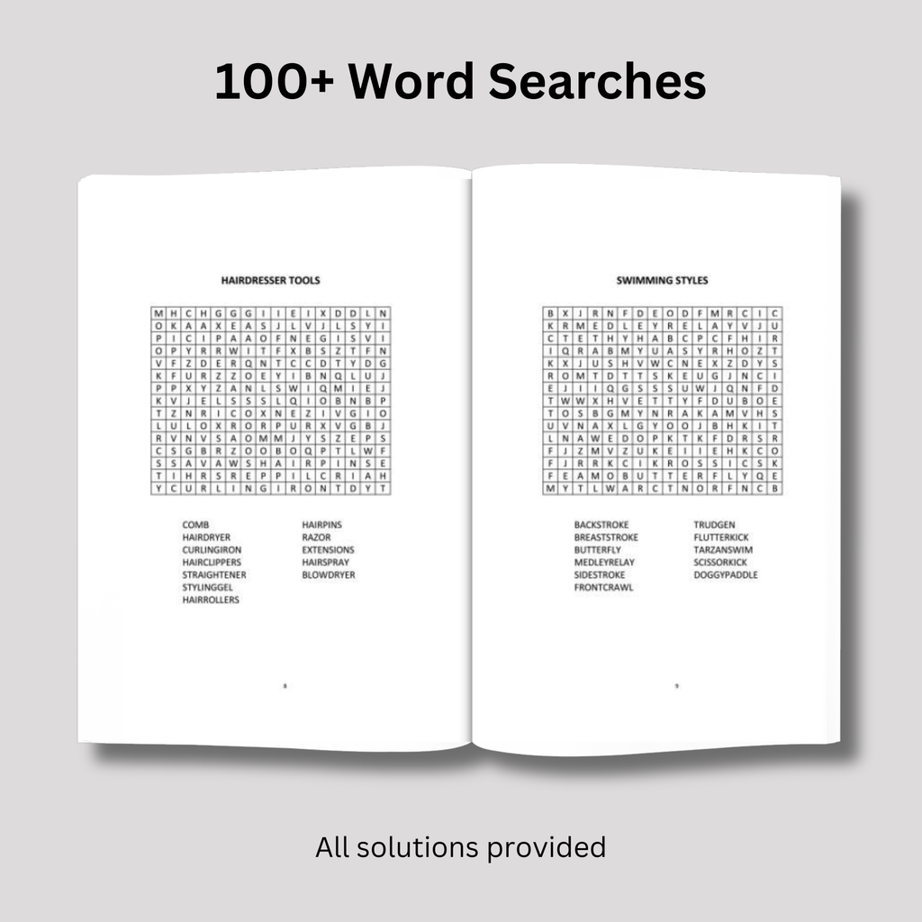 An open puzzle book lying flat on a gray surface, displaying two pages of word search grids from a collection of 100 puzzles.