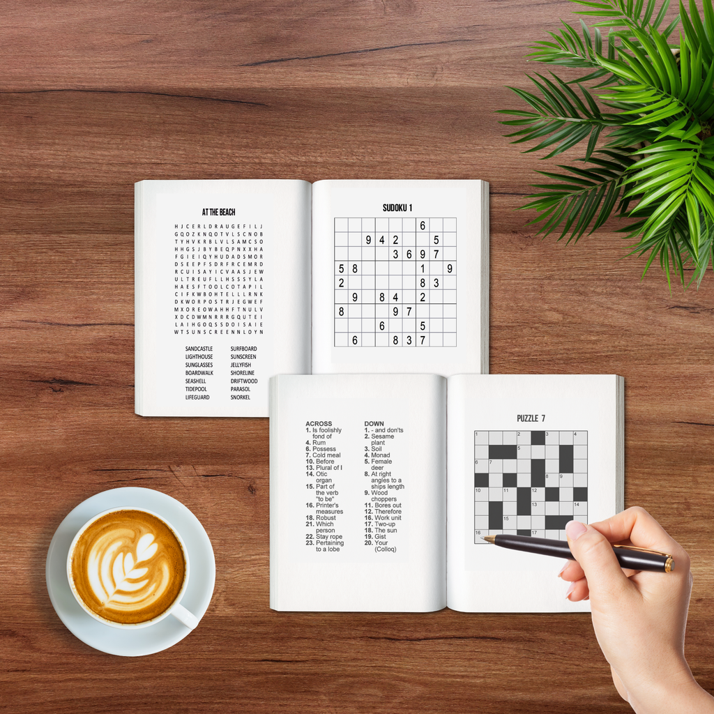 Pocket puzzle books open on a coffee table showing a word search, sudoku and crossword puzzle