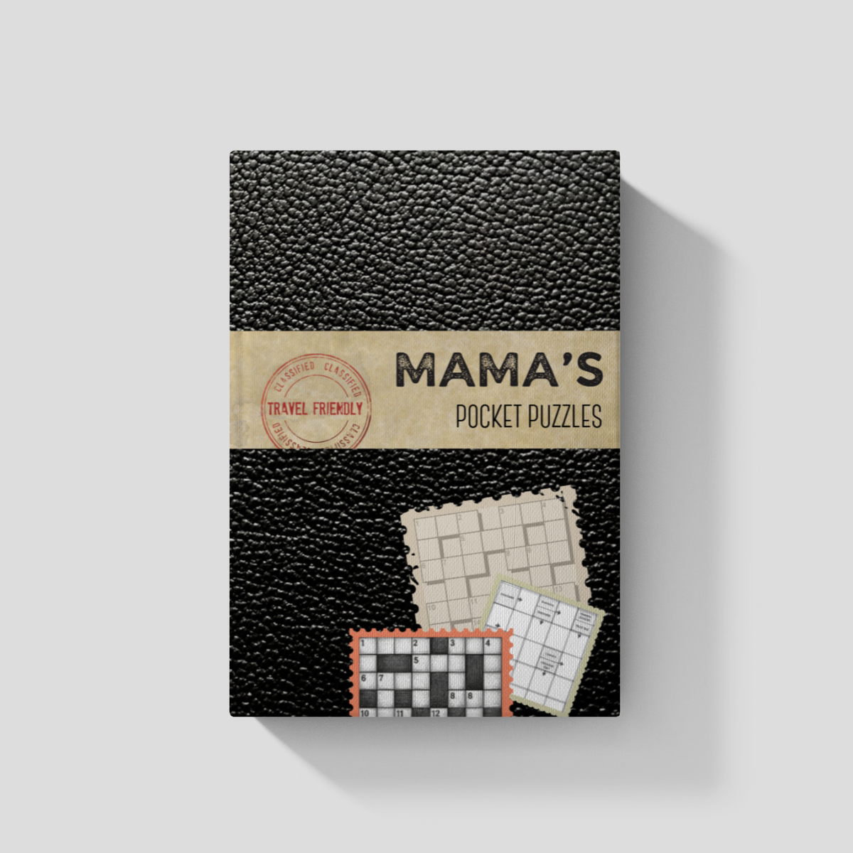 A boxed puzzle book titled "MAMA'S POCKET PUZZLES" shown upright on a light gray background. The cover has a black pebbled texture, a tan paper band across the middle with the title, and small sample puzzle cards near the bottom.